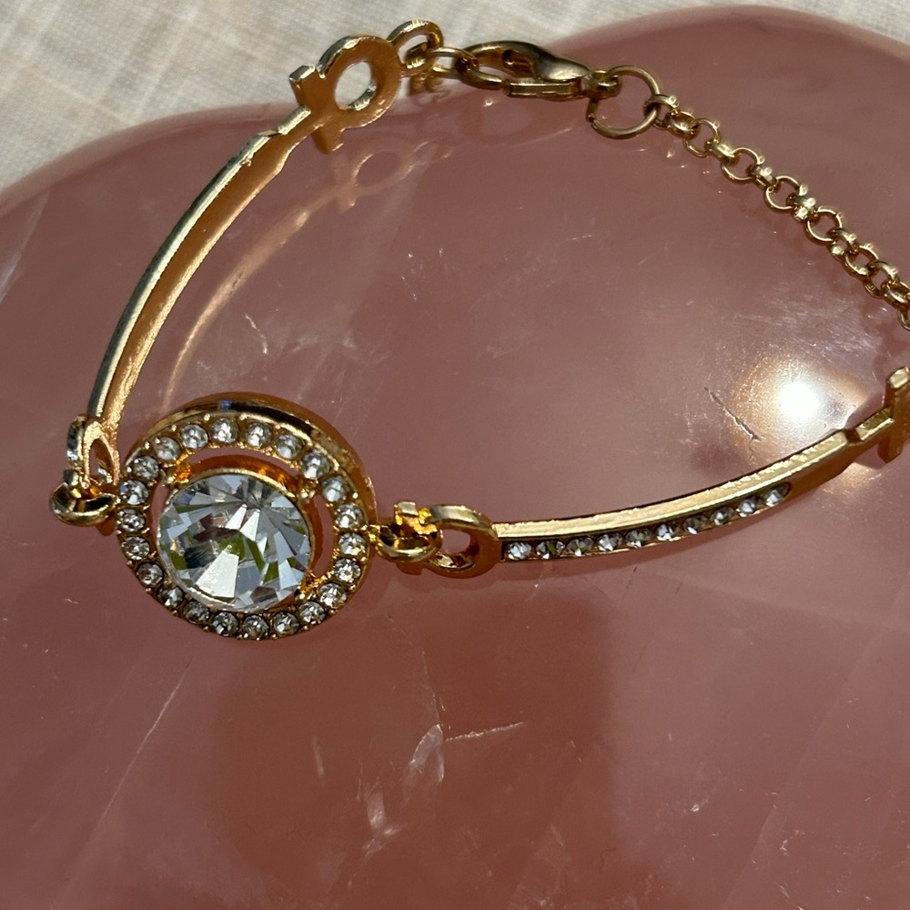 Gold and cubic zirconia focal stone with smaller cz’s each side. - Picture 7 of 9